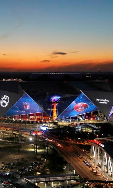 A deluge of drones fly over Super Bowl stadium, despite ban